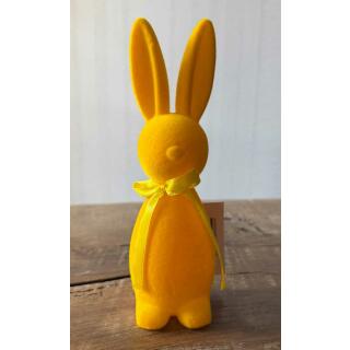 Hase mit Schleife beflockt stehend 18 cm - gelb